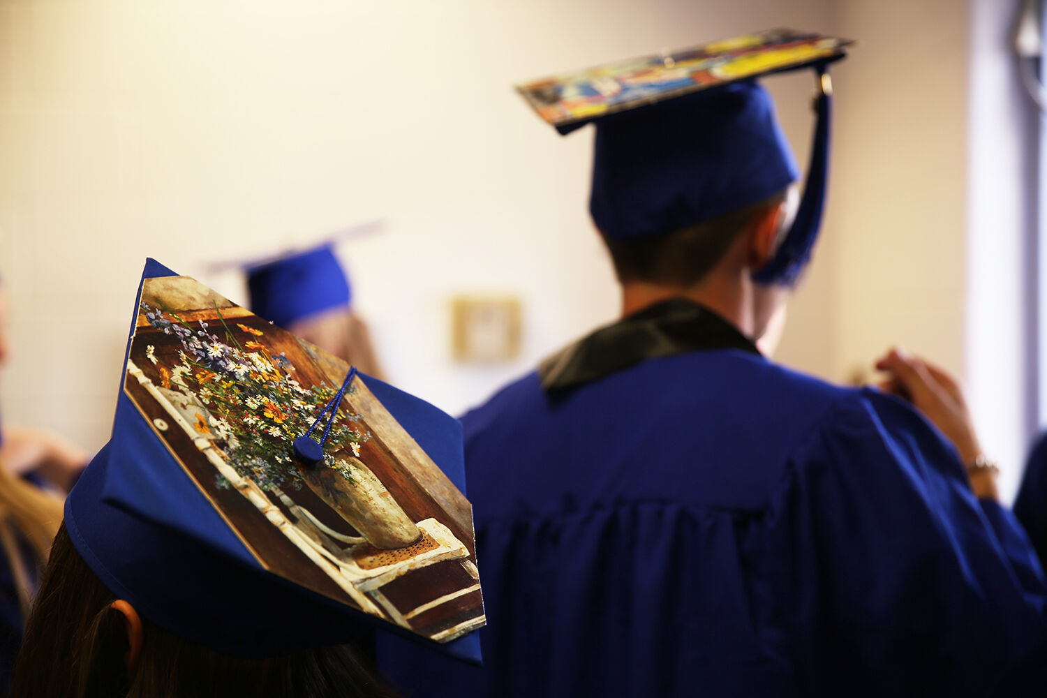 All 12 of the students graduating decorated their caps